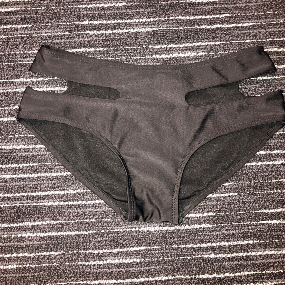 Black swim bottoms with cut outs